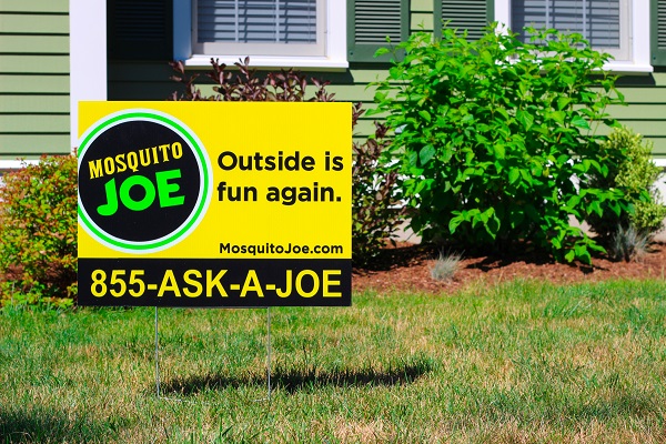 picture of a Mosquito Joe sign placed on the front lawn of a customer's house